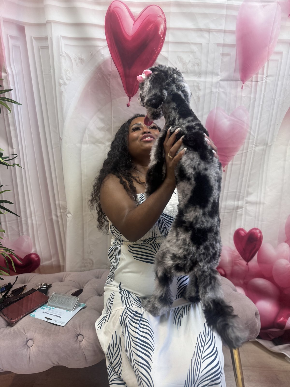 A PAWrent with a freshly groomed dog at Bark & Purr.